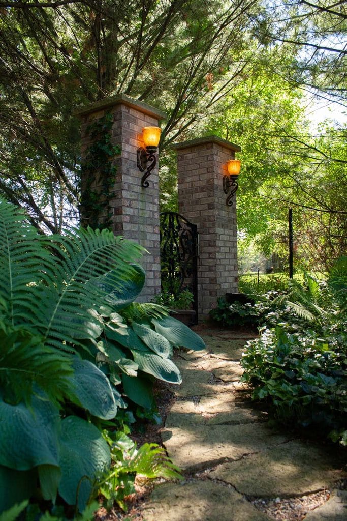 gate with brick pillars and lanscape